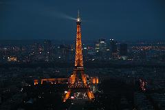 
Evening Lights On Eiffel Tower With La Defense Behind From Montparnasse Tower
